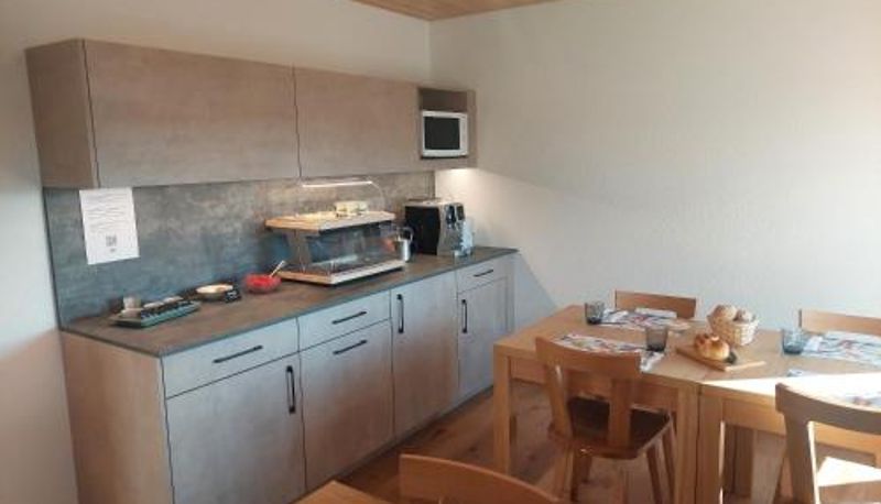 Sala de desayunos dentro del restaurante - B&B La Ferme De Pouillerel