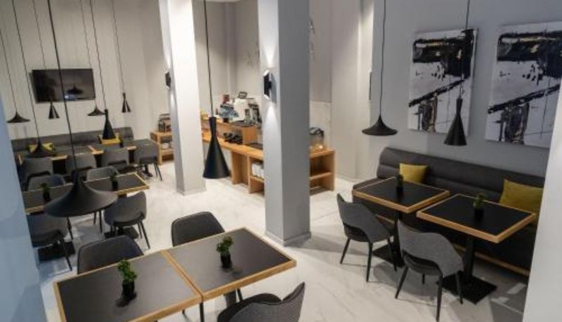 Frühstücksraum innerhalb des Restaurants - Grand Port Suites