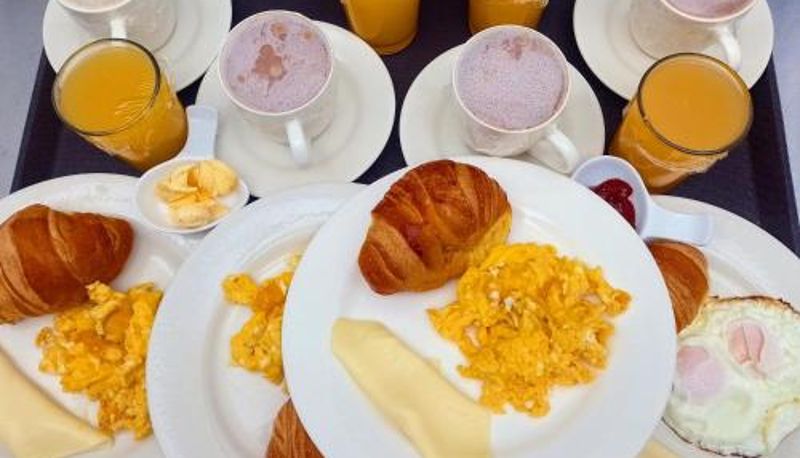 Sala prima colazione all'interno del ristorante - Apartamentos CasaMJ Tunja Confort y Parqueadero